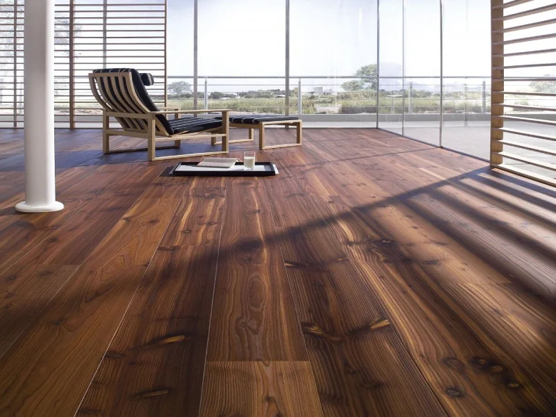 Commercial PVC flooring with a rich, dark wood grain