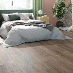 Audacity Ripple Oak Vinyl Plank Flooring Installed in bedroom