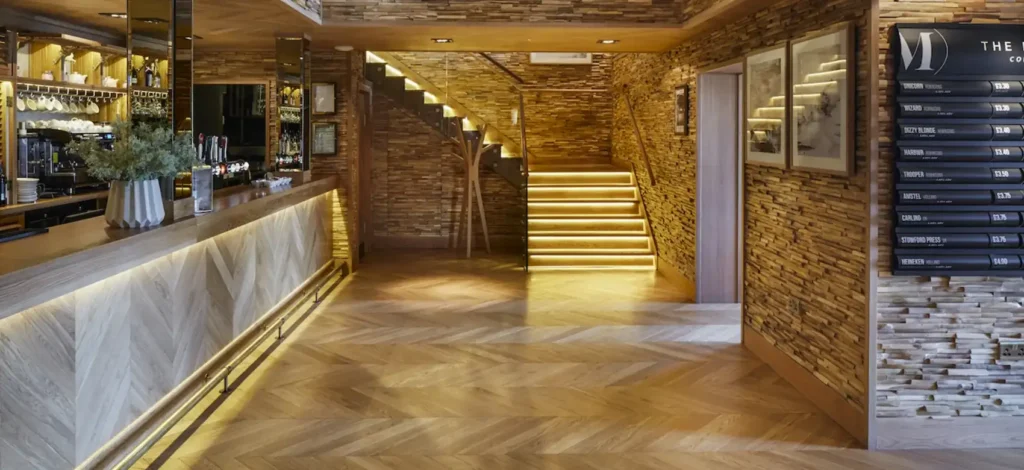 Light-colored chevron wood flooring