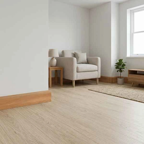 Light oak skirting board along wall