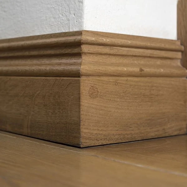 Natural oak skirting on wooden floor