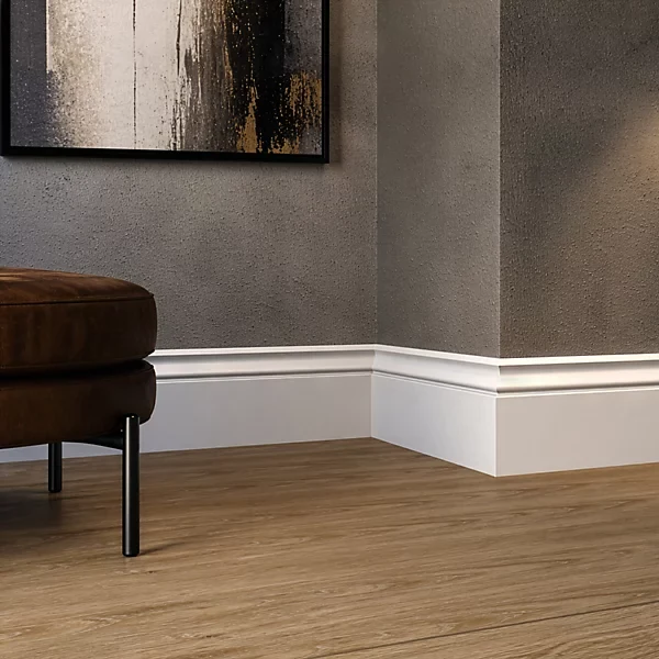 White skirting board along textured wall